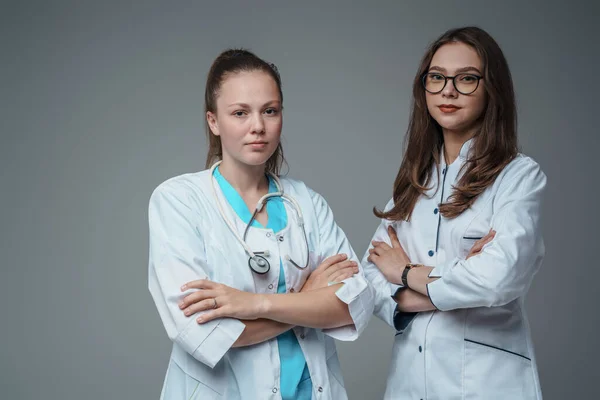 Studio Shot Two Female Doctors Dressed Labcoats Posing Crossed Arms — Stock Photo, Image