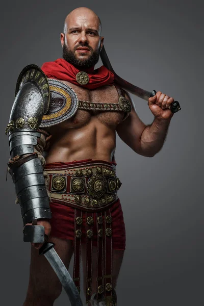 Portrait Ancient Gladiator Bare Torso Posing Dual Swords Grey Background — Stock Photo, Image
