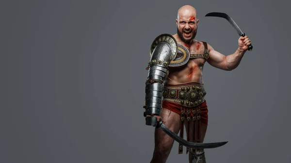 Portrait Violent Ancient Gladiator Screaming Holding Two Swords Grey Background — Stock Photo, Image