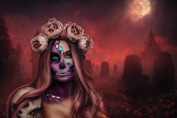 Glamour evil woman with muertos makeup and wreath of roses nighty graveyard.