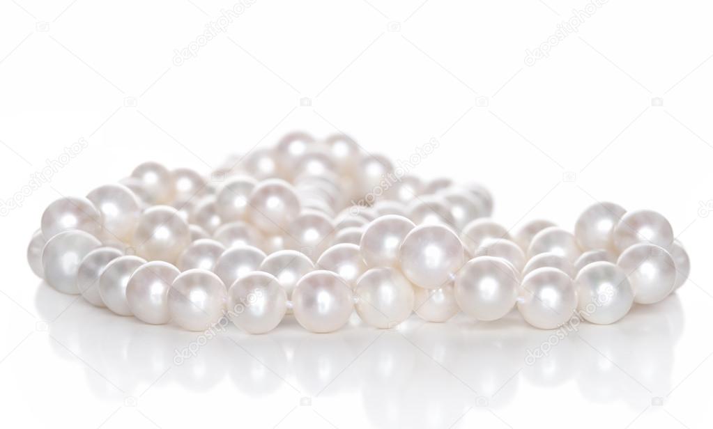 String of pearls on white background