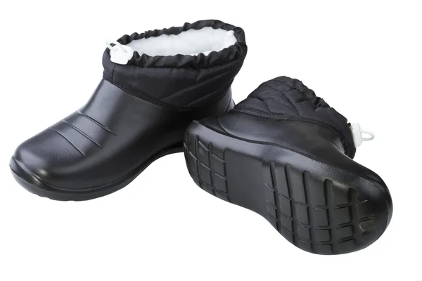 Vrouwelijke zwarte rubber schoenen — Stockfoto