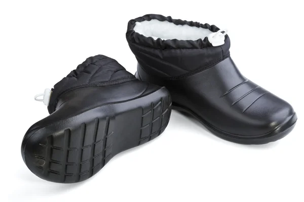 Vrouwelijke zwarte rubber schoenen — Stockfoto