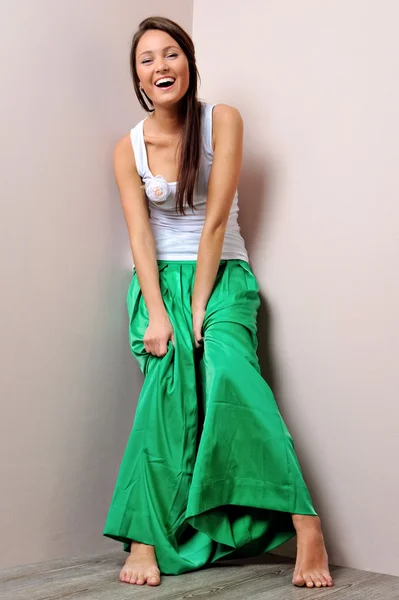 Beautiful woman in green skirt. — Stock Photo, Image