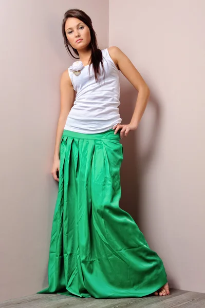 Beautiful woman in green skirt. — Stock Photo, Image