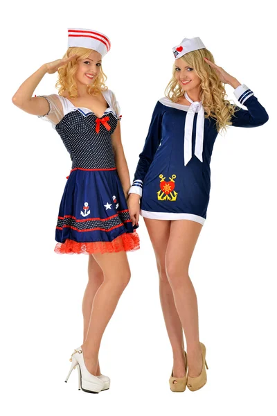 Две красивые женщины в сексуальных костюмах моряков на карнавале . — стоковое фото