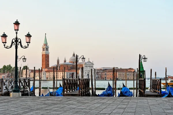 View to the gondolas and boats berth in Venice. — Stock Photo, Image