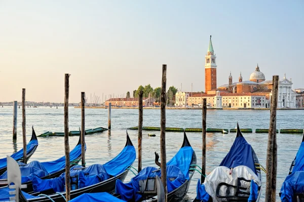 View to the gondolas and boats berth in Venice. — Stock Photo, Image