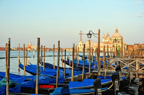 View to the gondolas and boats berth in Venice. — Stock Photo, Image