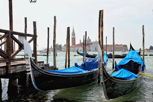 View to the gondolas and boats berth in Venice. — Stock Photo, Image