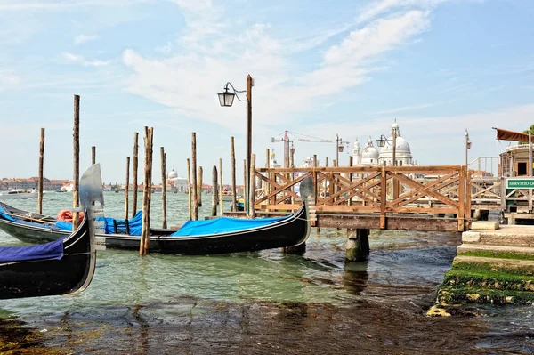 View to the gondolas and boats berth in Venice. — Stock Photo, Image