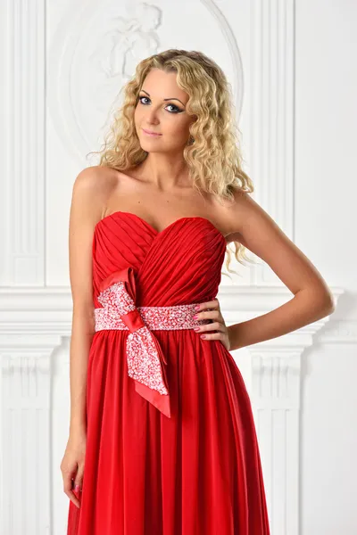 Beautiful blonde woman in red dress. — Stock Photo, Image