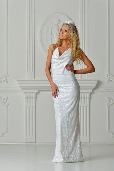 Beautiful blonde woman in white long dress — Stock Photo, Image