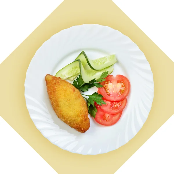 Chicken Kiev cutlet with vegetables on white plate. — Stock Photo, Image