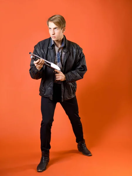 A cool hunter of evil spirits, a guy in a casual shirt and a leather jacket — Stock Photo, Image