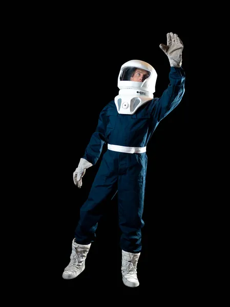 An astronaut in weightlessness reaches up with his hand. — Stock Photo, Image