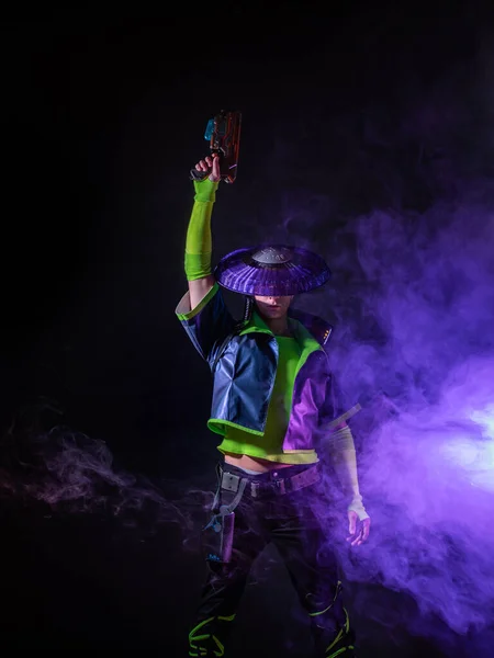 Futuristic character in a bright stylized outfit, photo with neon colors. — Stock Photo, Image