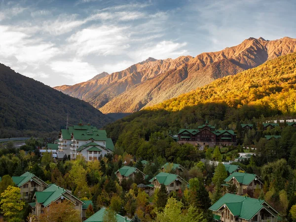 Cottage village in mountains, houses for outdoor recreation in a mountain hollow