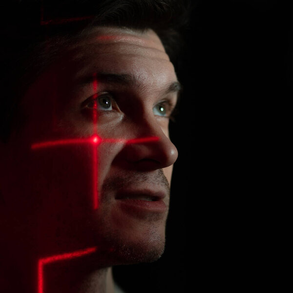 Modern technologies and human. young man with projection of red lines