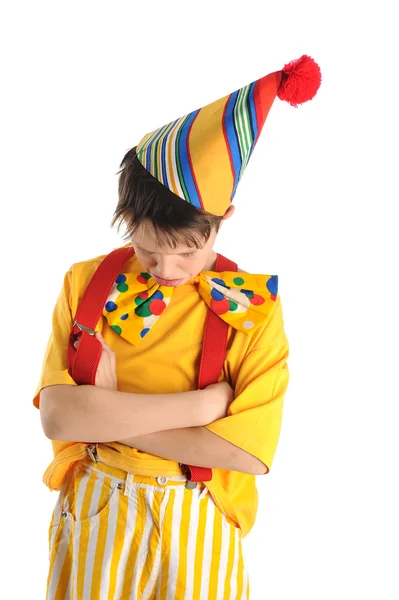 Grollender Clown-Junge lizenzfreie Stockbilder