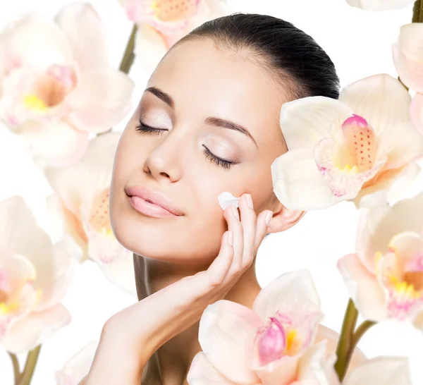Woman applying cosmetic cream on face — Stock Image Woman applying cosmetic cream on face Stock Picture