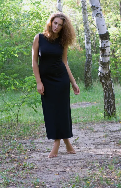 Beautiful girl in a summer forest — Stock Photo, Image