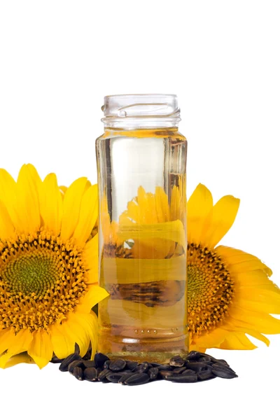 Semillas de girasol y aceite vegetal en una botella — Foto de Stock