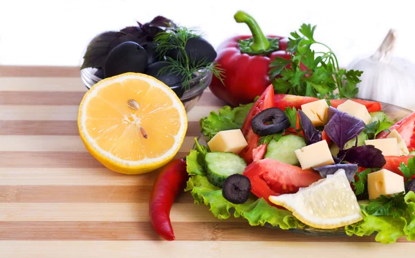 Salad and vegetables isolated on white background — Stock Photo, Image