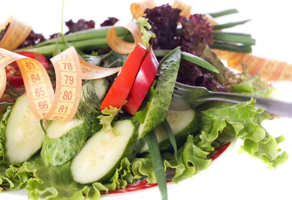 Assorted salad and tape measurement — Stock Photo, Image