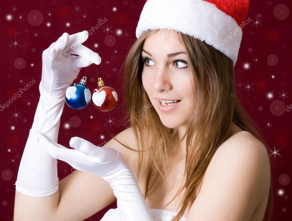 Beautiful woman with christmass toys