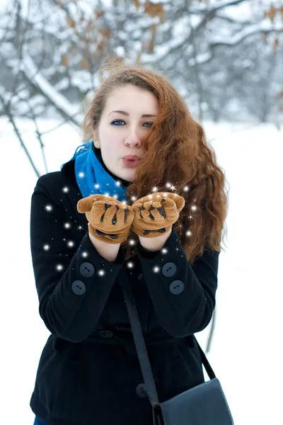 Girl playing with snow in winter — Stock Photo, Image