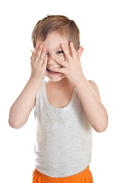 Portrait of a boy, looking through his hands — Stock Photo, Image