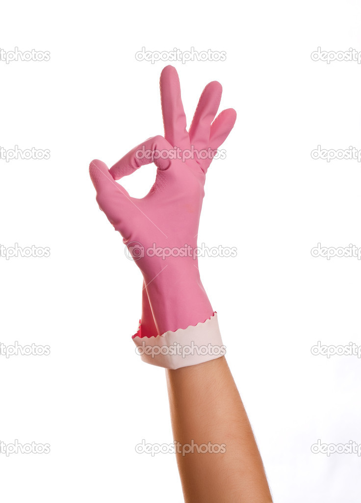 Hand wearing pink rubber glove shows OK sign, isolated over whit