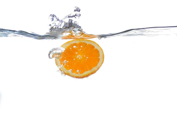 Orange falls in water — Stock Photo, Image