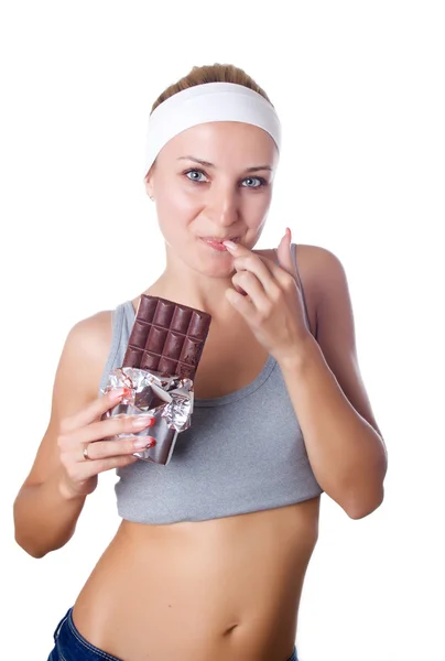 Woman eating chocolate — Stock Photo, Image