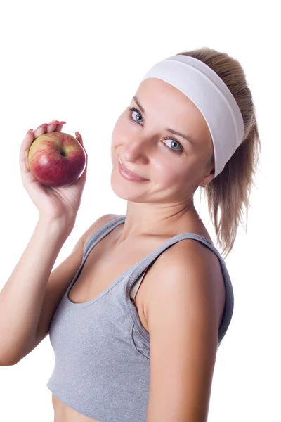 Gesundheit - gesunde junge Frau präsentiert einen Apfel lizenzfreie Stockbilder
