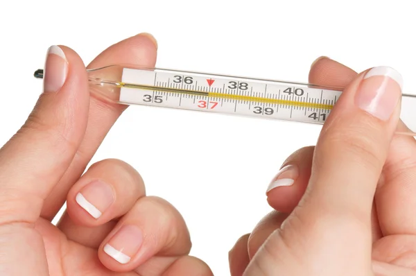 Hand met thermometer — Stockfoto