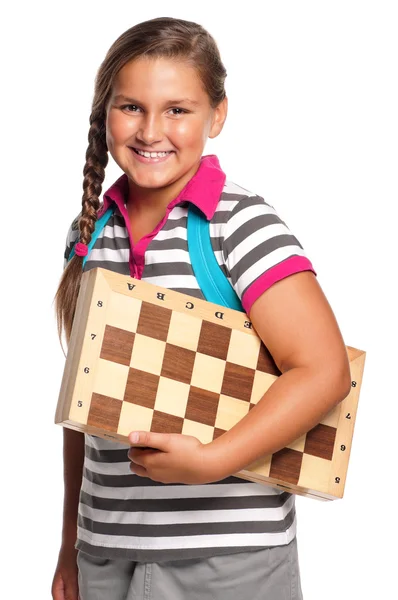 Schoolmeisje met schaakbord — Stockfoto