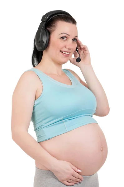 Gravid med hörlurar — Stockfoto