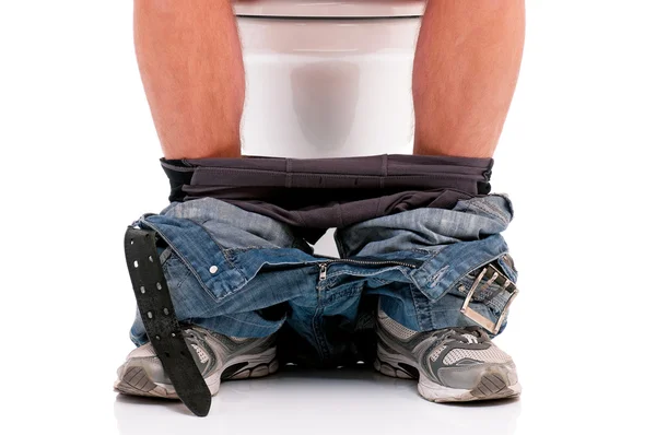 Man on toilet bowl — Stock Photo, Image