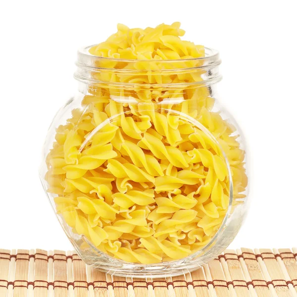 Pasta in glass pot — Stock Photo, Image