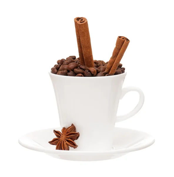 Cup with coffee beans and spices — Stock Photo, Image