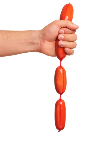 Hand with sausage — Stock Photo, Image