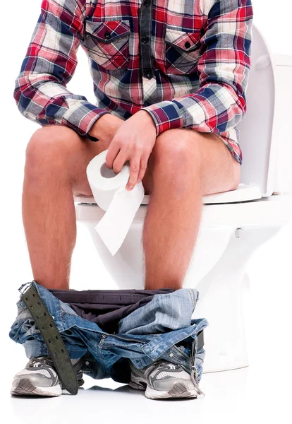 Mann auf Toilettenschüssel — Stockfoto