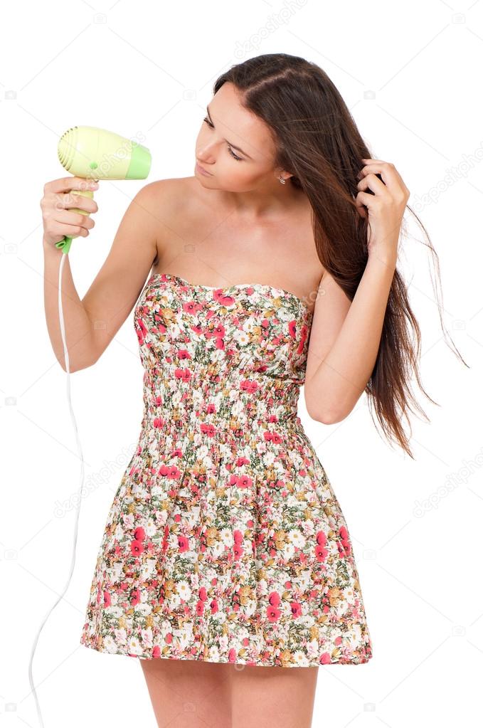 Woman holding hair dryer