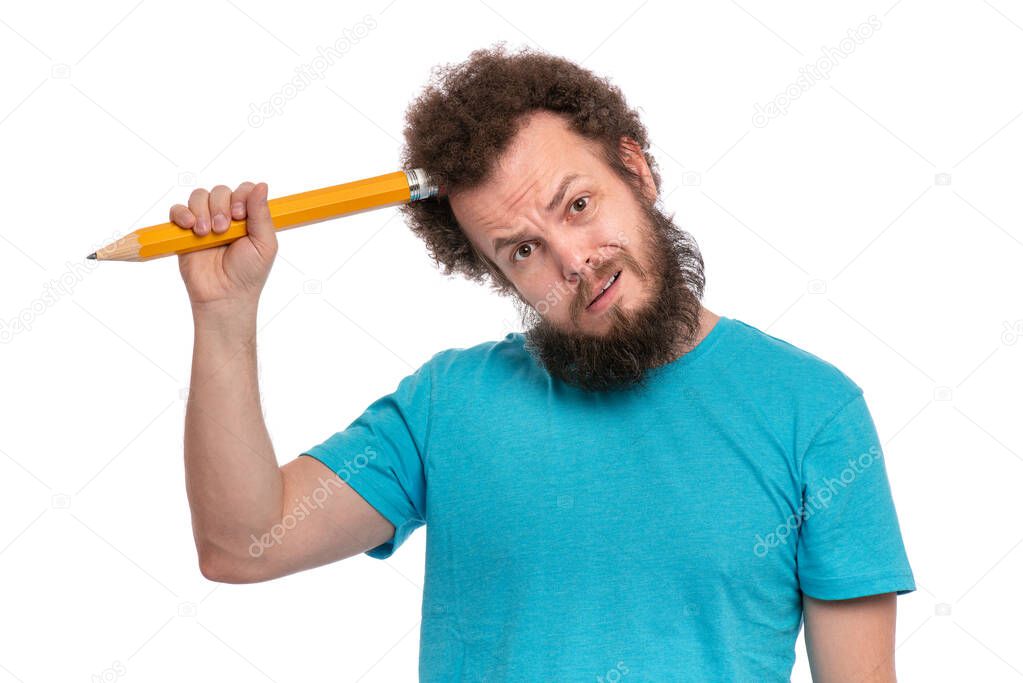Bearded man holding big pencil