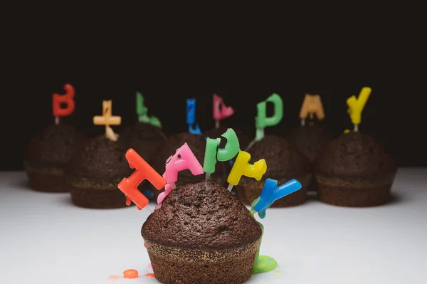 Cupcakes with birthday candles — Stock Photo, Image