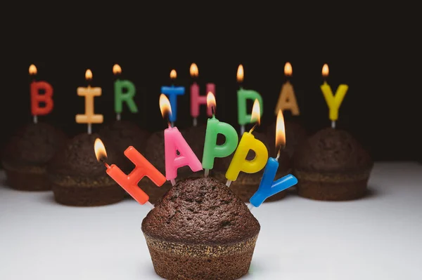 Cupcakes with birthday candles — Stock Photo, Image