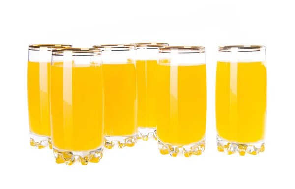 Plnou sklenici pomerančové šťávy na pozadí — Stock fotografie