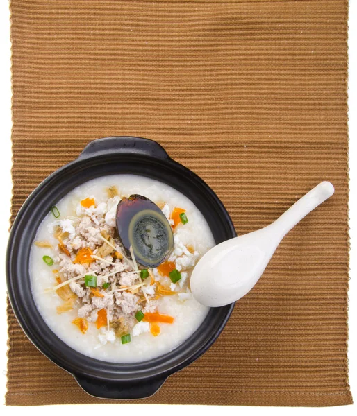Traditional chinese century egg & pork porridge rice gruel serve Stock Picture